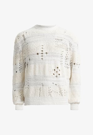 Hvit strikket genser med ulike utskjæringsmønstre, med en teksturert overflate og ribbestrikkede mansjetter. Rund hals-design, lett oversized passform.