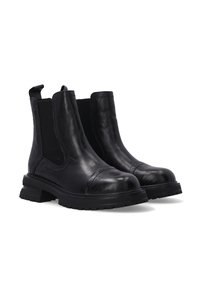 Sorte læder ankelstøvler med elastiske sidelapper, rund tå, cap toe-detaljer og en robust gummisål. Glat tekstur med minimal syning.