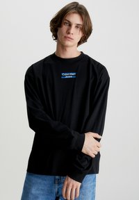 Calvin Klein Jeans TRANSPARENT STRIPE LOGO LS - Hosszú ujjú felső - ck black