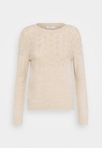 Beige trui met een ronde halslijn, met een gestructureerd patroon op de bovenhelft en ribbelmanchetten en -zoom. Gemaakt van een zachte, lichte stof.