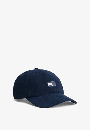 Cappellino da baseball in corduroy blu navy con etichetta rettangolare ricamata con il testo "TOMMY JEANS", visiera curva e costruzione a sei pannelli.