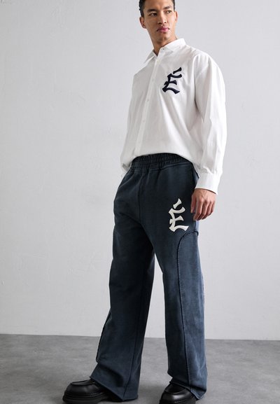 Études PANT EMBROIDERED - Tracksuit bottoms - navy