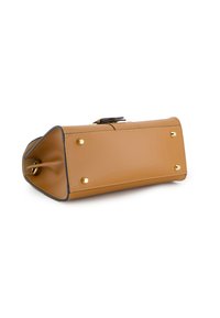 Tan leather handbag with a rectangular shape, featuring gold studs on the base and a flat closure. Smooth texture with contrasting edges.