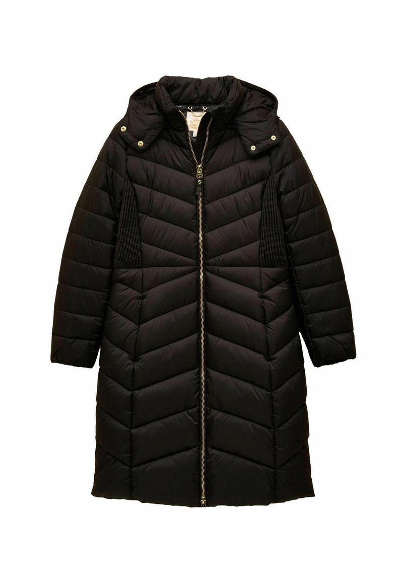 Melnā pūkaina jaka ar chevron dizainu, kapuci un pilnu rāvējslēdzēju. Iezīmē sānu ribotu paneļu un zelta aksesuāru detaļas. Garas piedurknes.