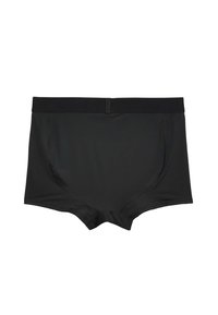 Bóxer de algodón negro con cintura elástica, con textura suave y sin patrones o acentos visibles. Diseño ligeramente ajustado.