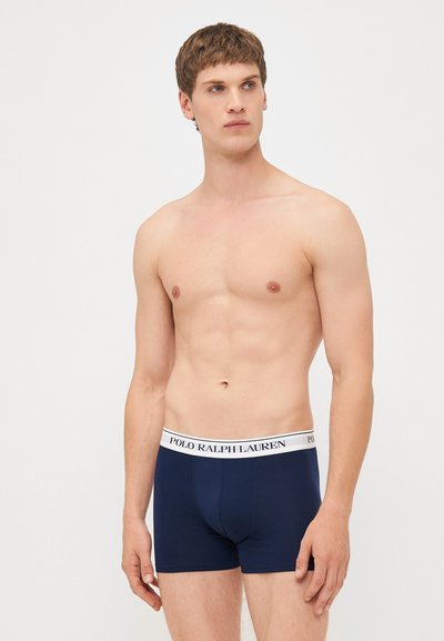 Boxeri de culoare bleumarin, confecționați dintr-un material moale, având un elastic lat alb cu brandul "POLO RALPH LAUREN" în partea de sus.