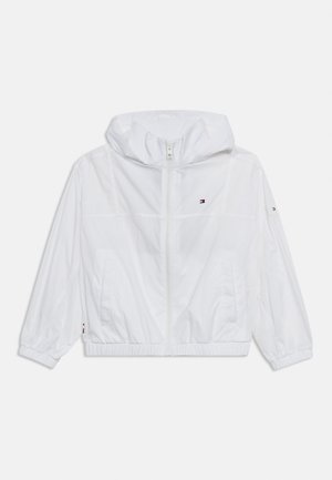 Λευκό φούτερ με κουκούλα και φερμουάρ, με ελαστικές μανσέτες και τελείωμα, διακοσμημένο με μικρά λογότυπα Tommy Hilfiger στο στήθος, το μανίκι και την πλαϊνή τσέπη.