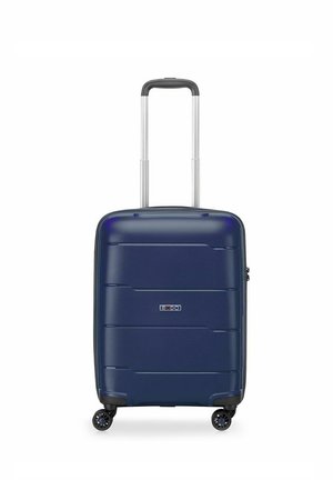 Navy hard-shell suitcase with horizontal grooves, extendable silver handle, four black wheels, and side zipper closure.