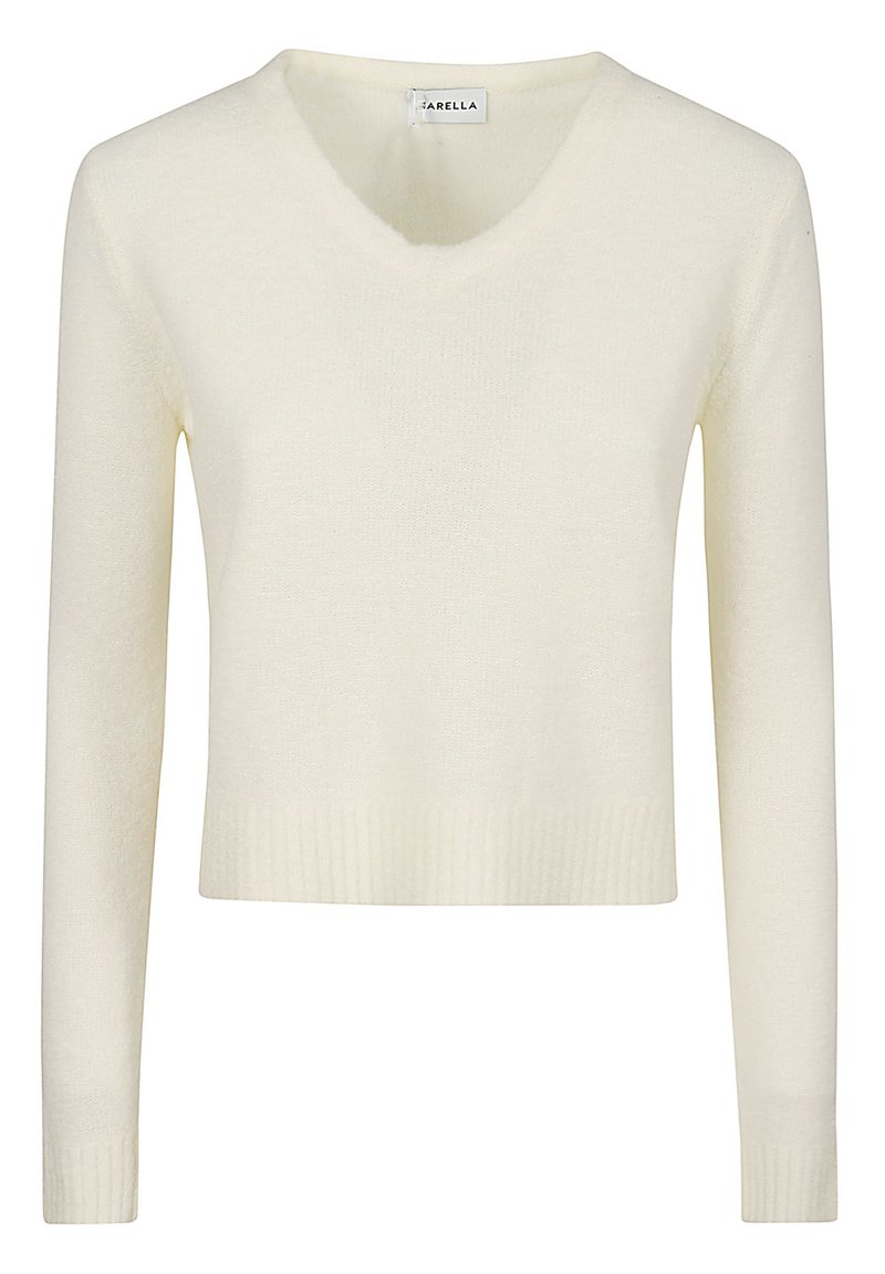 Maglione corto color crema con scollatura a V, maniche lunghe e dettagli a costine all'orlo e ai polsini. Tessuto morbido e design minimale.