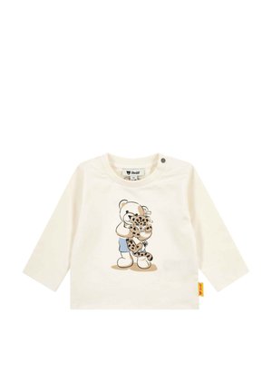 Cream long-sleeve baby shirt with print of a teddy bear hugging a leopard cub, featuring snap buttons on shoulder and a yellow brand tag.