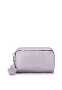 Purple nylon cosmetic pouch with a rounded shape, zip closure, and a fluffy charm attached. Features a logo embossed on the front.