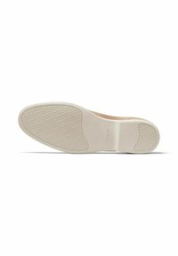 Shoe sole featuring a textured, off-white rubber finish with a smooth beige accent at the heel, designed for grip and durability.