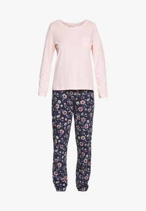 Cotton pajama set with a light pink long-sleeve top featuring a chest pocket, paired with navy floral-print pants.