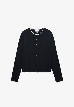 Cardigan noir à manches longues avec bordure blanche, encolure ronde et sept boutons avant semblables à des perles, posé à plat sur fond blanc.