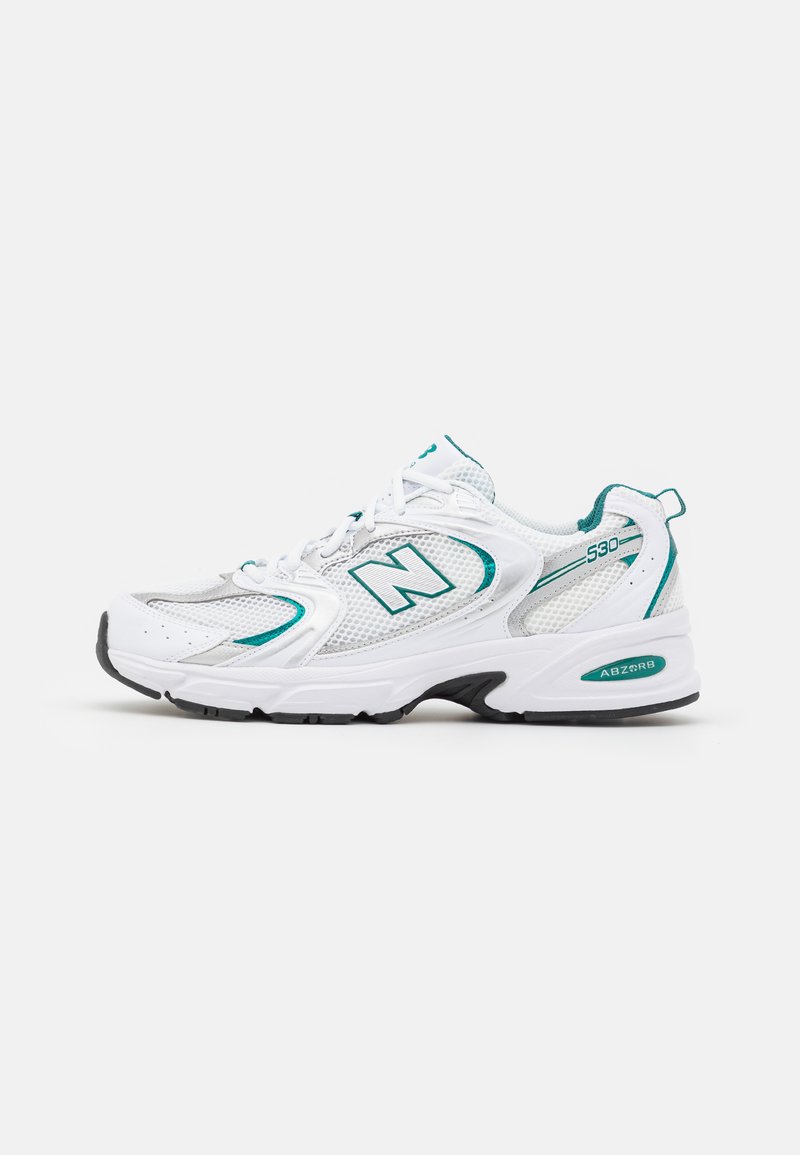 White athletic shoe with mesh and synthetic panels, turquoise accents, rounded toe, lace-up front, and black rubber sole.