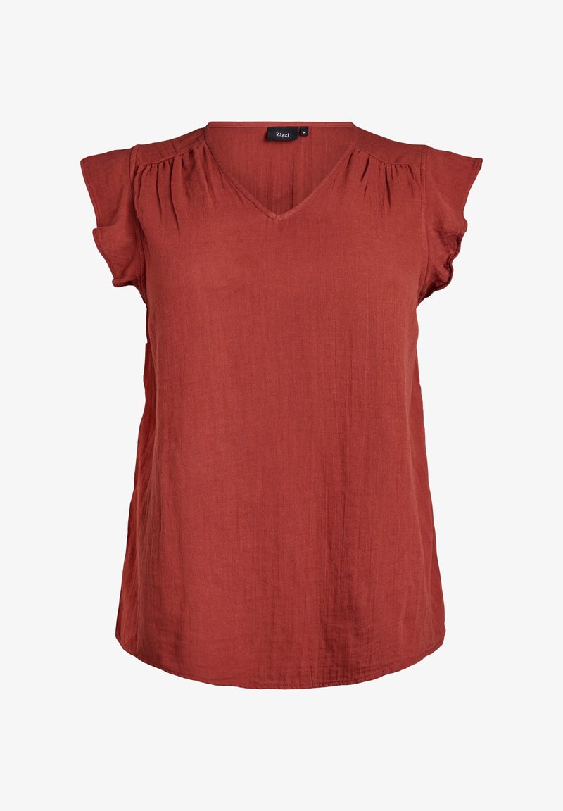 Blouse à manches courtes couleur rouille avec encolure en V et fronces douces près des épaules, confectionnée dans un tissu léger texturé.