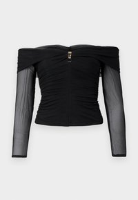 Haut noir à épaules dénudées avec un tissu froncé, de longues manches transparentes et un fermoir doré à l'arrière. Texture lisse avec une silhouette ajustée.