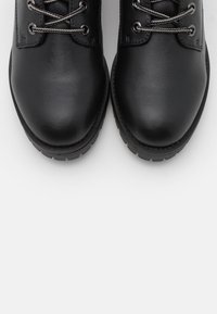 Anna Field Tronchetti - black