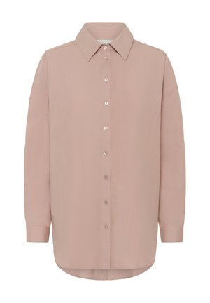 Long-sleeve button-up shirt in muted pink with pointed collar and rounded hem, designed for a loose, relaxed fit.