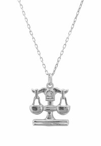 Silver necklace featuring a scale pendant, detailed with bowls on each side, hanging from a simple link chain.