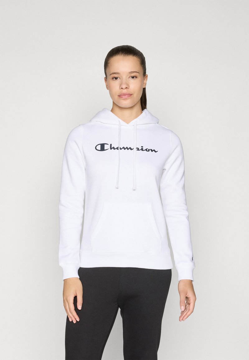 Sweat-shirt à capuche blanche avec poche avant, arbore le logo noir "Champion". Tissu doux, manches longues, poignets côtelés. Coupe décontractée.