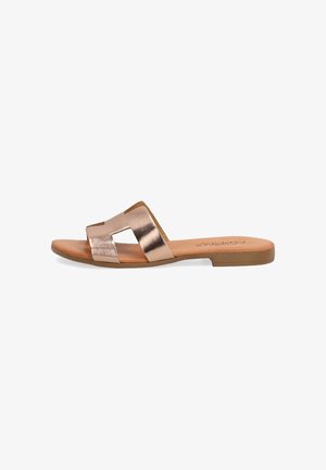 Metallic rose gold slide sandal with a wide strap design, flat sole, and minimalist style, featuring a smooth texture and no embellishments.