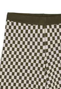 Leggings tricotés avec un motif à damiers vert et blanc. La ceinture est côtelée pour plus de confort et d'élasticité.
