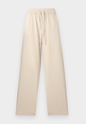 Pantalon beige à jambes larges avec taille élastique et cordon de serrage, ourlet droit, sans poches apparentes, présenté à plat sur un fond clair.