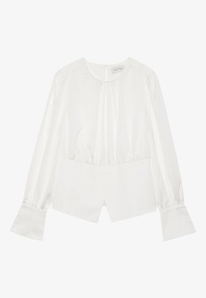 Blusa bianca con maniche lunghe a sbuffo, polsini arricciati e stile incrociato davanti. Realizzata in un tessuto liscio e lucido con una leggera lucentezza.