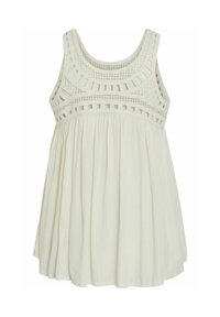 Blusa sin mangas de color beige claro con una parte superior de crochet texturizado y una tela fluida y recogida en la parte inferior, que presenta un sencillo escote redondo.