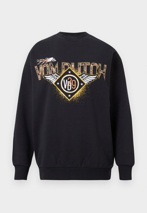 Black crewneck sweatshirt with "VON DUTCH" text, winged emblem, flames, and "VD 29" logo in gold, white, and orange colors on front.
