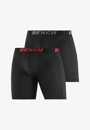 Schwarze Boxershorts für Herren mit eng anliegendem Schnitt, aus glattem Stoff gefertigt. Verfügt über einen roten Elastikbund, auf dem "BENCH ATHLEISURE" deutlich sichtbar ist.