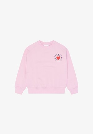 Lyserød sweatshirt med ribbet manchetter og bund, med et lille rødt hjerte og sorte strålegrafik med ordet "create" på venstre bryst.