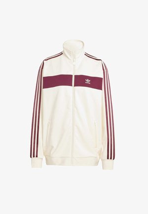 White track jacket with a high collar, maroon horizontal stripe across the chest, maroon three-stripe accents on sleeves, zip pockets.