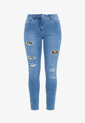 Blaue Skinny-Jeans aus Denim mit Leopardenmusterstoff, der durch mehrere ausgefranste Risse an den vorderen Oberschenkeln und Knien sichtbar ist.