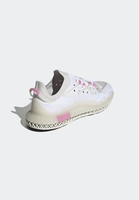 White athletic shoe with a knitted upper, gray and pink accents, and a translucent sole featuring an intricate design. Lightweight and flexible.