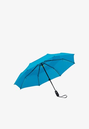 Blue compact umbrella open with black frame and handle with wrist strap on a white background.