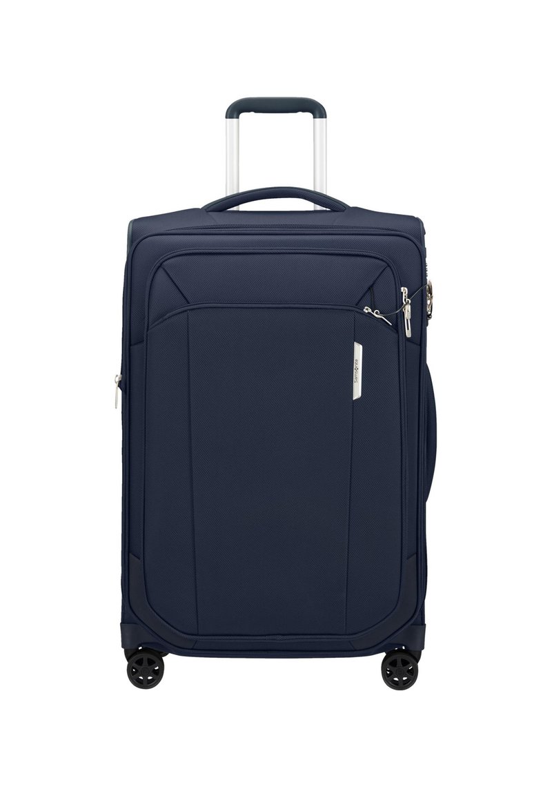 Valigia rigida blu navy con finitura testurizzata, manico retrattile, tasca frontale e quattro ruote nere per una facile manovrabilità.