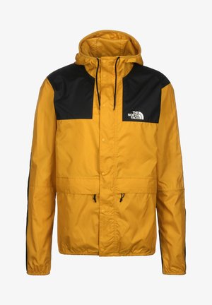 Veste d'extérieur à capuche jaune et noire avec boutons-pression à l'avant, cordons de serrage, et logo "The North Face" sur la poitrine.