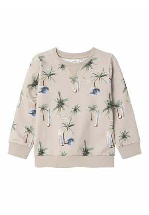 Sudadera beige de manga larga con estampado tropical completo de palmeras, tablas de surf, olas y hamacas.