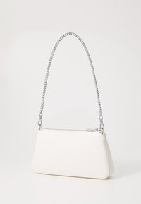 White leather handbag with a geometric design, silver chain handle, zip closure, and smooth texture. Compact and angular shape.