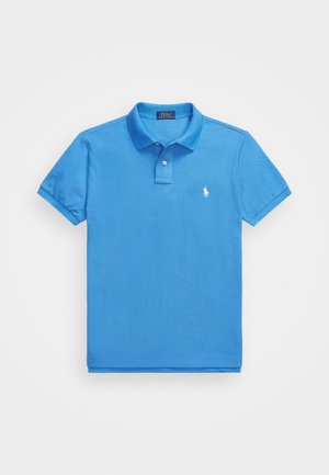 Light blue polo shirt made of cotton, featuring a classic collar, two-button placket, short sleeves, and a small white logo on the chest.