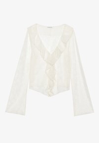 Hvit blondebluse med dyp V-hals, lange ermer og volangnederkant. Stoffet har et strukturert blomsterdesign gjennom hele.