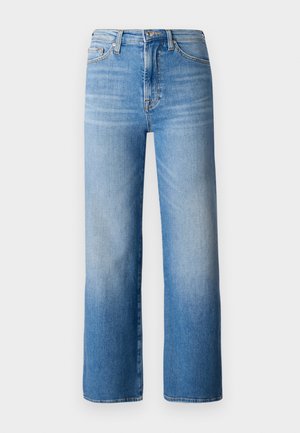 Lyseblå vide bukser laget av denim. Har middels høy midje, fem lommer og en falmet vask med subtile tonale variasjoner.