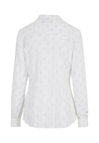 White long-sleeve blouse featuring an embroidered floral pattern, ruffled collar, and buttoned cuffs. Soft cotton fabric with a smooth texture.