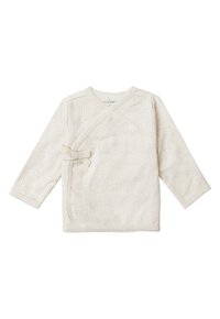 Licht beige lange mouwen wikkelshirt gemaakt van ribgebreid materiaal. Beschikt over een klein strikdetail aan de voorkant en delicate rafelende randen.