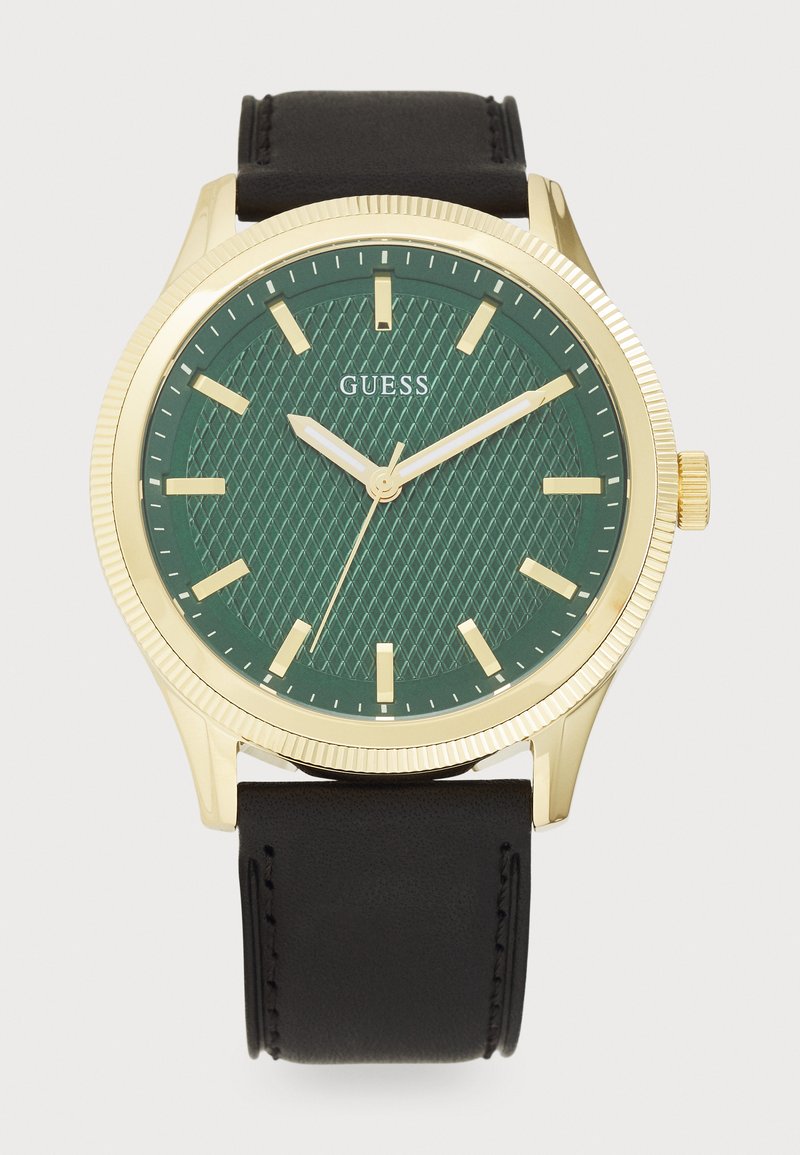 Orologio con quadrante verde strutturato, dettagli in oro, lunetta dorata e cinturino in pelle nera. Presenta indicatori e lancette minimali.