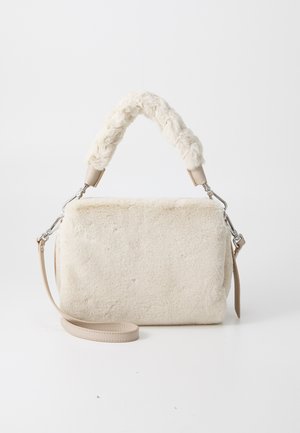 Cream-colored bag with soft, textured fur body. Features a plush braided handle and a detachable strap with silver hardware accents.