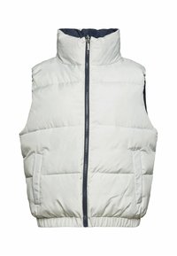 Veste sans manches matelassée blanche avec col montant, fermeture éclair à l’avant, poches latérales et base élastiquée sur fond blanc.