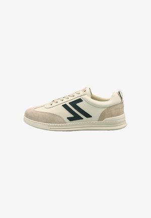 White leather sneakers with beige suede accents, featuring a black logo design, lace-up closure, and textured rubber sole.